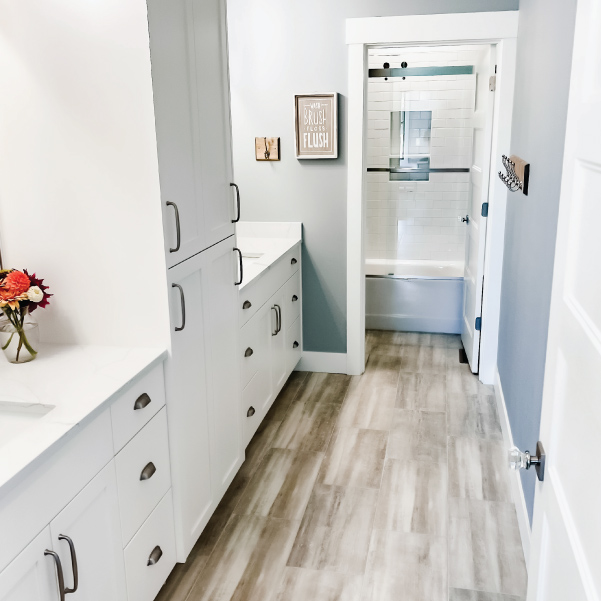 A farmhouse bathroom with two sinks and private shower A farmhouse bathroom with two sinks and private shower