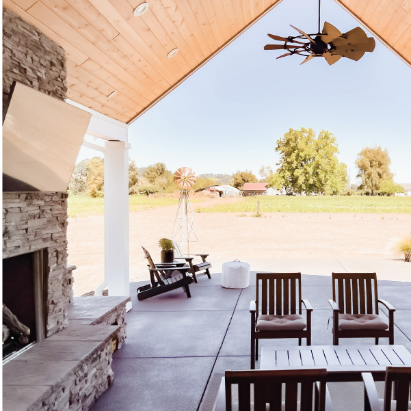 Outdoor covered seating area with fireplace and overhead fan Outdoor covered seating area with fireplace and overhead fan