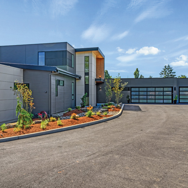 Driveway entrance of an industrial modern home built by Riddle Construction Driveway entrance of an industrial modern home built by Riddle Construction