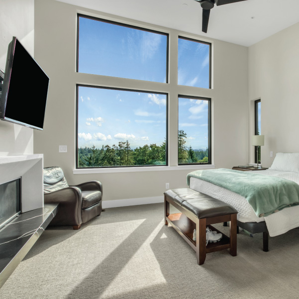 View into a bedroom with asymmetrical windows to capture the view built by Riddle Construction View into a bedroom with asymmetrical windows to capture the view built by Riddle Construction