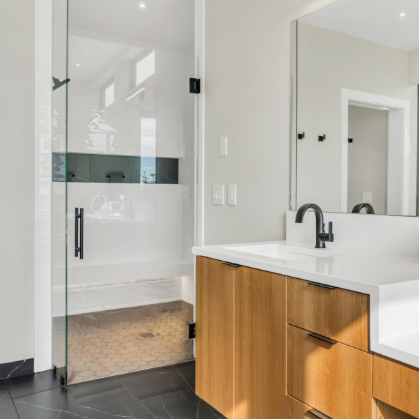 White walk-in shower with bathroom sink White walk-in shower with bathroom sink