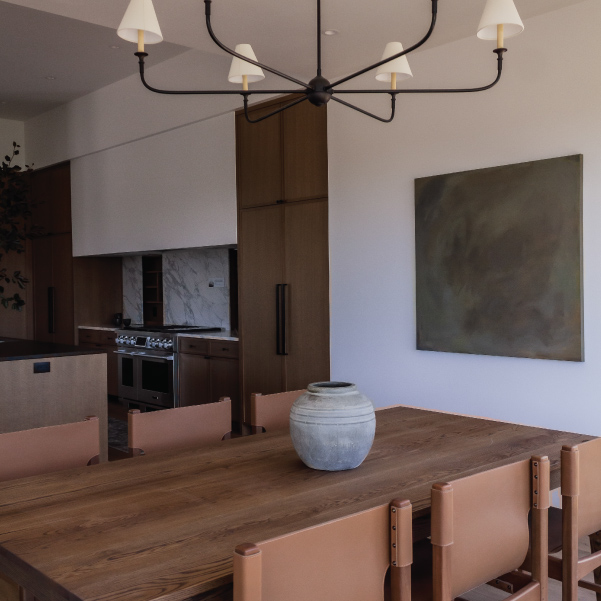Tranquil dining table next to the open kitchen of the Lagom built by Riddle Construction Tranquil dining table next to the open kitchen of the Lagom built by Riddle Construction