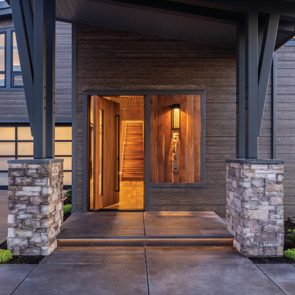Front door of a modern coastal home with overhead protection Front door of a modern coastal home with overhead protection