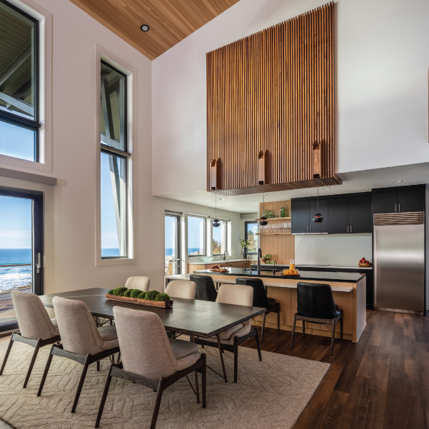 Modern Oregon coast design of a dining area and open concept kitchen built by Riddle Construction Modern Oregon coast design of a dining area and open concept kitchen built by Riddle Construction