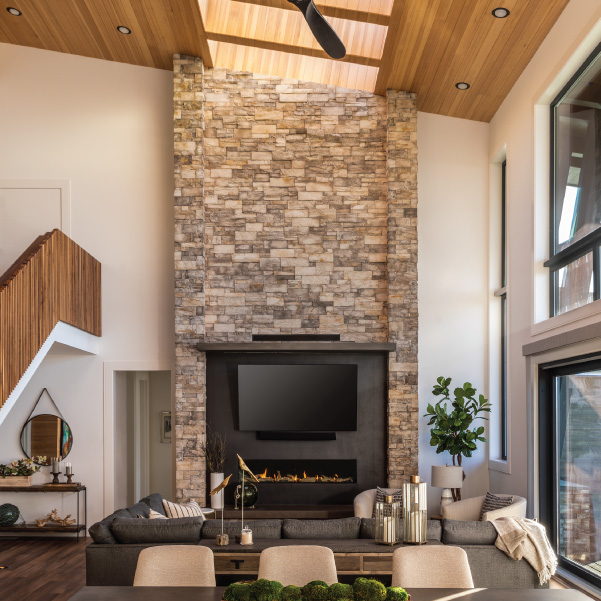 Stone fireplace with TV surround in a living area of an Oregon coast home built by Riddle Construction Stone fireplace with TV surround in a living area of an Oregon coast home built by Riddle Construction