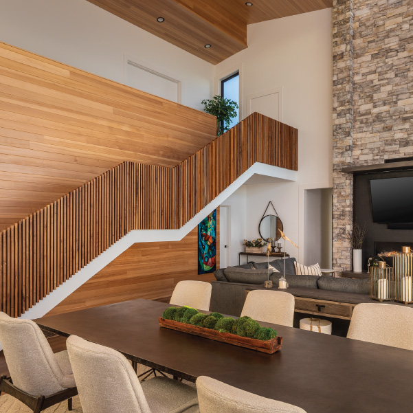 Modern wood staircase overlooking living area of coastal home built by Riddle Construction Modern wood staircase overlooking living area of coastal home built by Riddle Construction