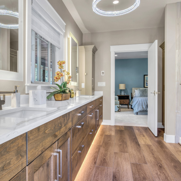 Wall of bathroom cabinets leading to a bedroom in a custom home built by Riddle Construction Wall of bathroom cabinets leading to a bedroom in a custom home built by Riddle Construction