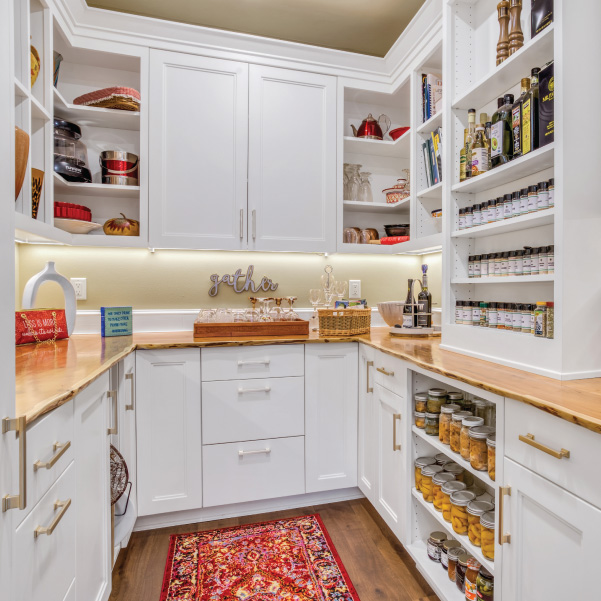 A white walk-in pantry with floor-to-ceiling cabinets in a custom home built by Riddle Construction A white walk-in pantry with floor-to-ceiling cabinets in a custom home built by Riddle Construction