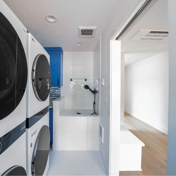 Two stacked laundry units and a dog wash Two stacked laundry units and a dog wash