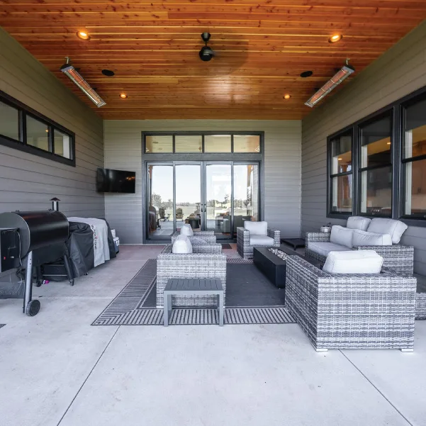 Outdoor living space featuring gray furniture Outdoor living space featuring gray furniture