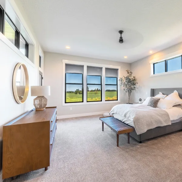Bedroom with high windows on two walls and full windows on one wall Bedroom with high windows on two walls and full windows on one wall
