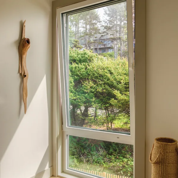 View out of a custom home window in Neskowin, Oregon View out of a custom home window in Neskowin, Oregon