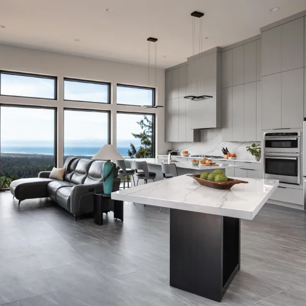 Living area of a custom home with a view of the Oregon Coast - Riddle Construction R | C Estuary Vista Home